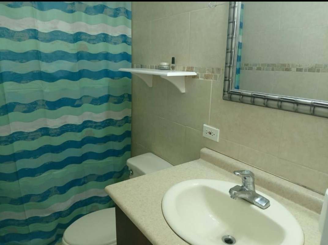 Spacious master bedroom with large windows and city views in PH Oasis Towers Panama