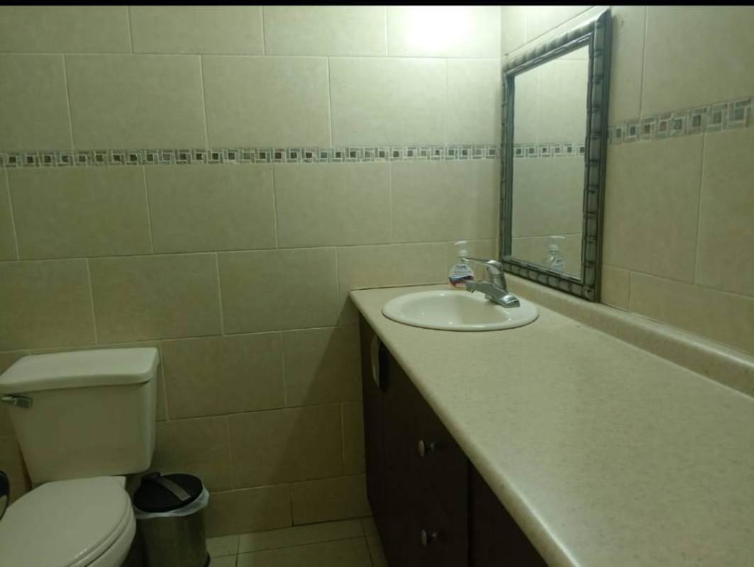 Modern tiled bathroom with walk-in shower and vanity PH Oasis Towers Panama