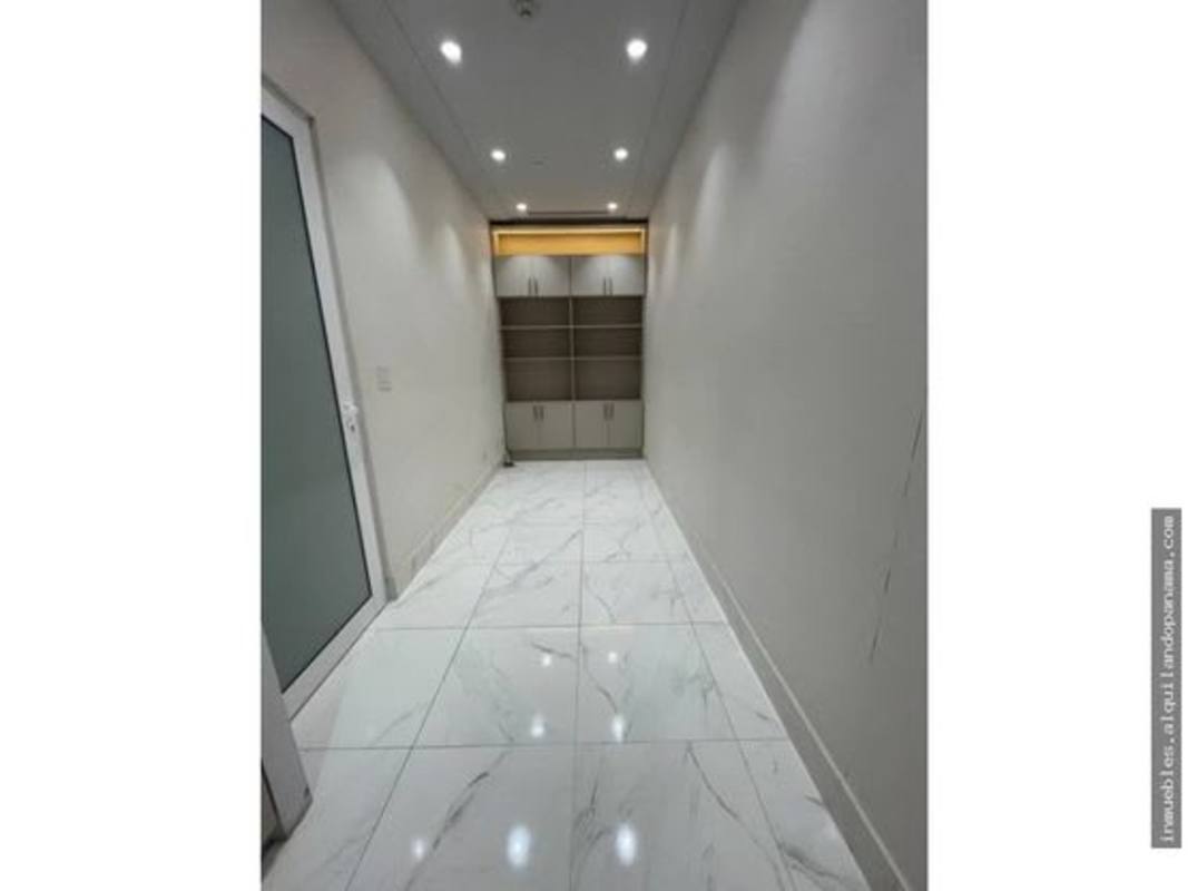 Waiting room with modern chairs, planter and bright lighting inside Town Center commercial complex