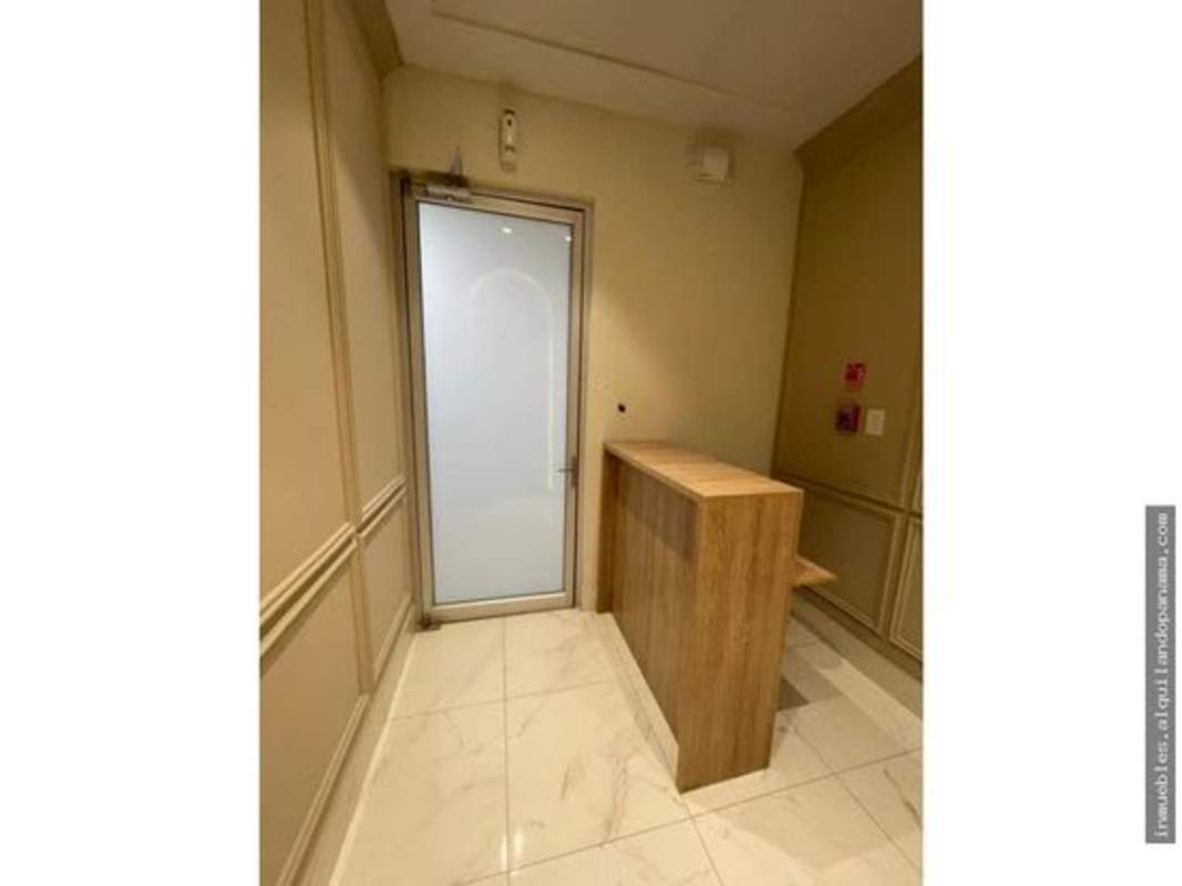Utility room with beige cabinets, marble countertop, and recessed lighting at Town Center Costa del Este