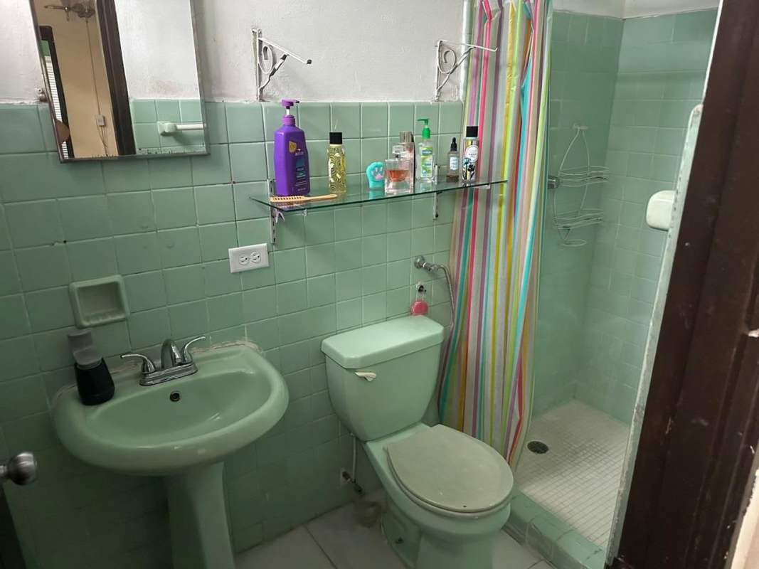 Kitchen with tile backsplash ceiling fan and refrigerator house for sale Chanis Panama