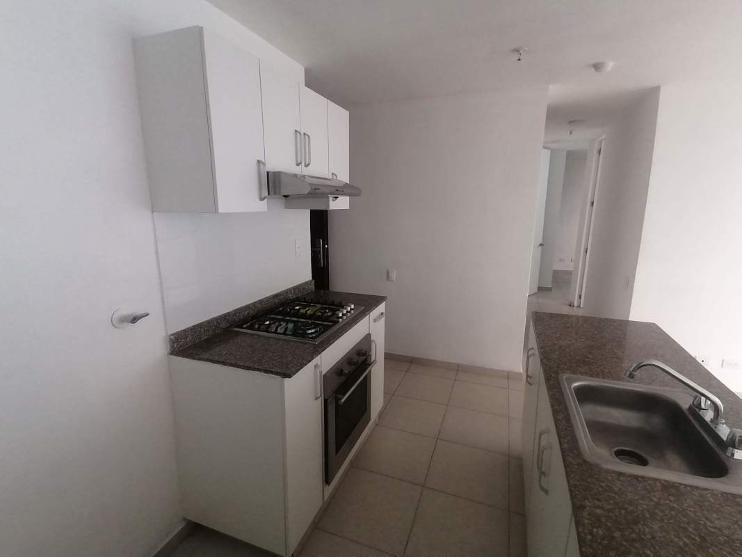 Modern kitchen granite countertop, built-in oven and gas cooktop PH Alsacia Tower Condado del Rey Panama
