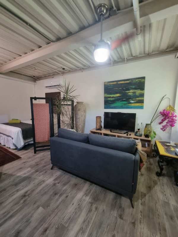 Industrial design studio with sofa TV exposed ceiling PH Clayton Park Panama