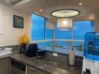 Large bedroom with balcony access and Pacific views in Santa Clara Sky Residences Panama