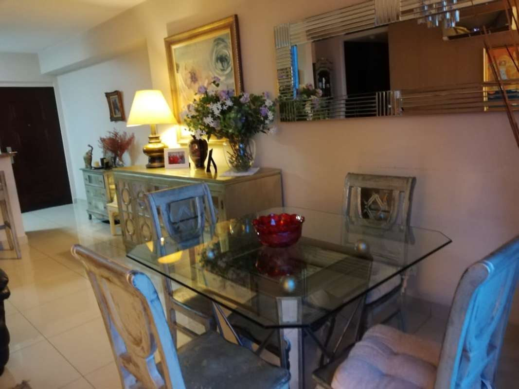 Modern kitchen with breakfast bar and adjacent dining area in PH Top Tower Costa del Este Panama