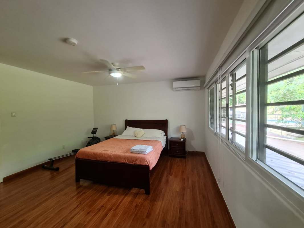 Modern facade with covered parking landscaped hedge and pathway Clayton Panama