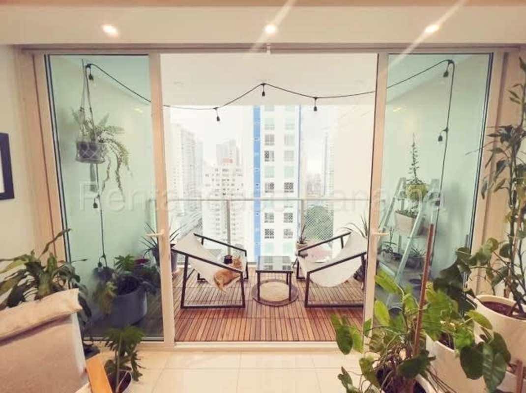 Spacious living and dining area with balcony access in furnished apartment PH Genesis Tower Panama