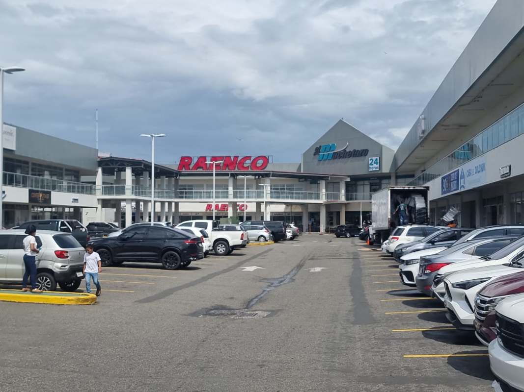Contemporary mall exterior with parking lots and retail shops in Costa Sur Shopping Center, Panama City