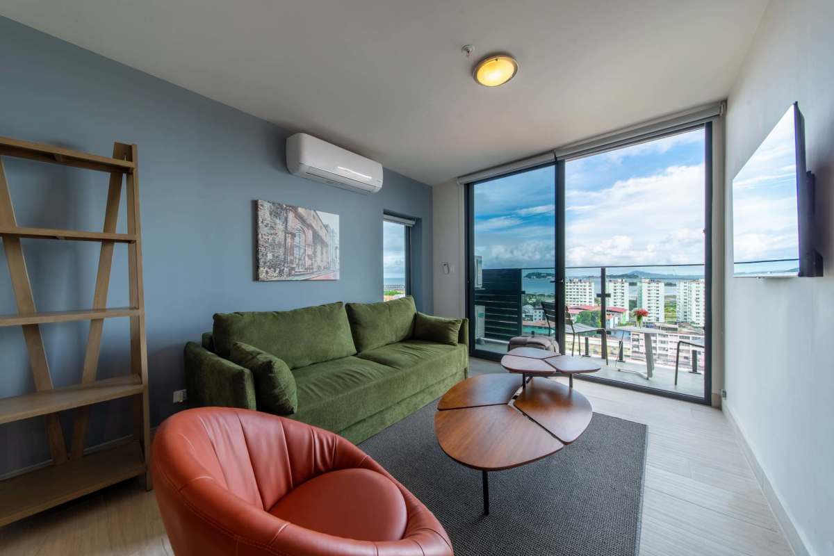 Living room large windows ocean and skyline views Casa Lefevre Casco Viejo Panama