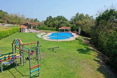 Swimming pool, playground, gazebos lush lawns in Valle Village gated community