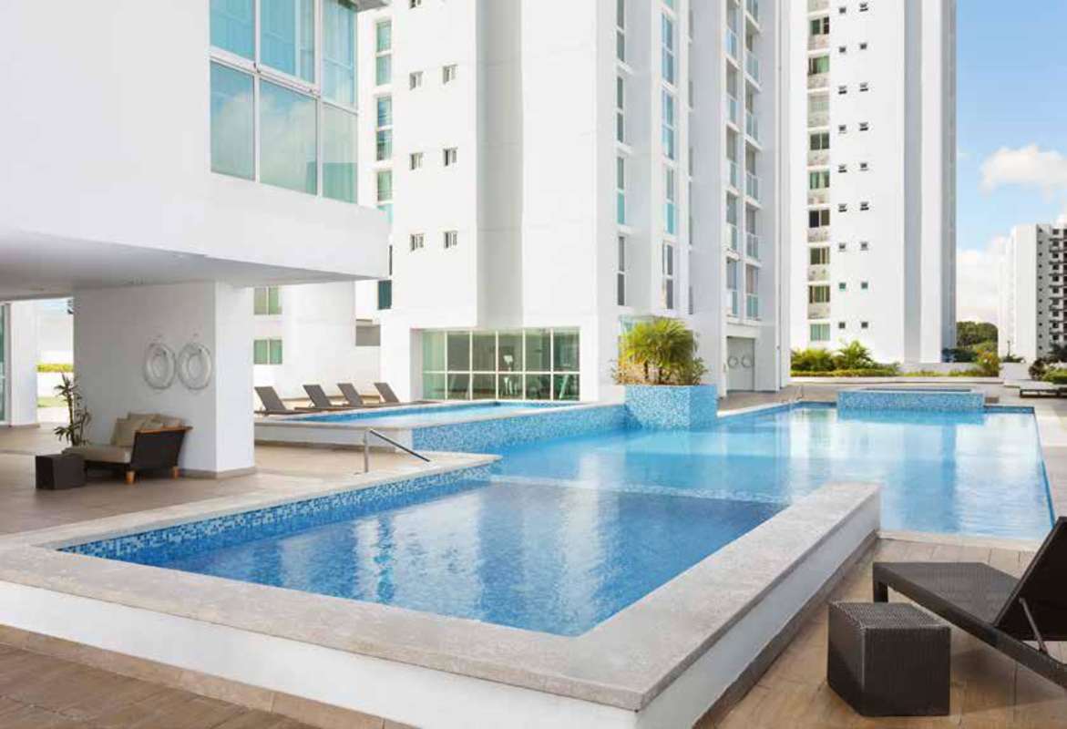 Modern facade of Kings Park residential towers with landscaped entrance Condado del Rey Panama