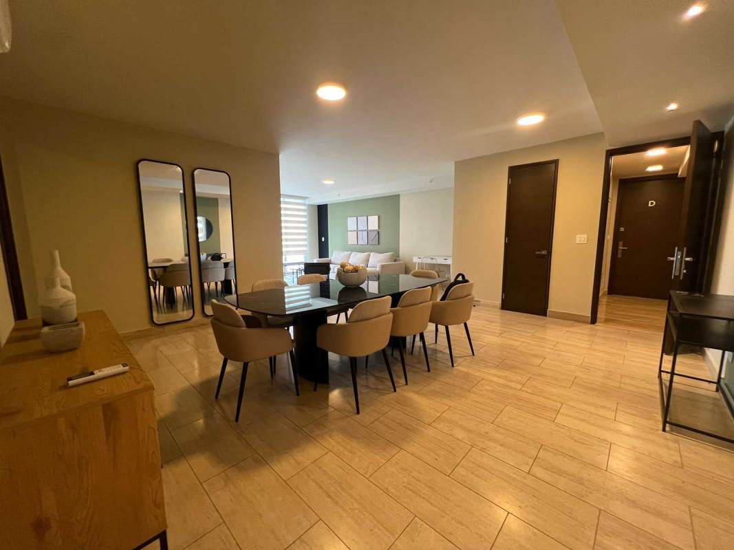 Open plan kitchen with modern appliances and granite countertop at PH The Regent Costa del Este Panama