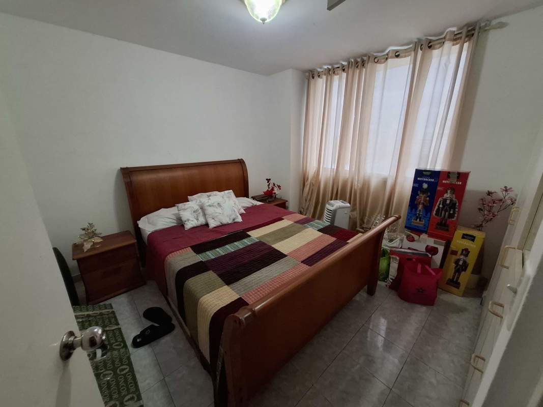Bathroom with sliding glass shower door mirror sink in PH Vista Tower Obarrio Panama