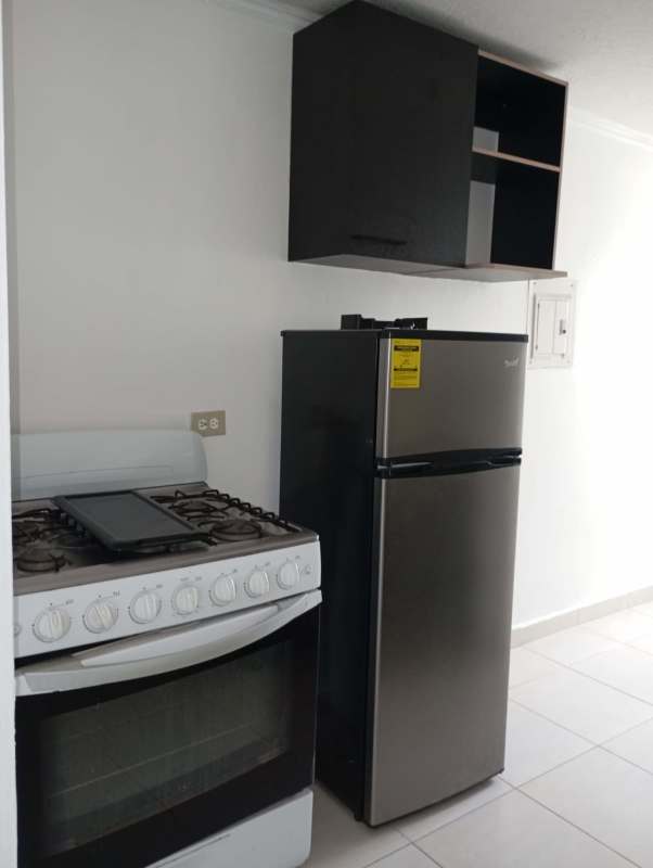 Full bathroom with shower enclosure, toilet and ceramic tiles in Río Abajo Panama City