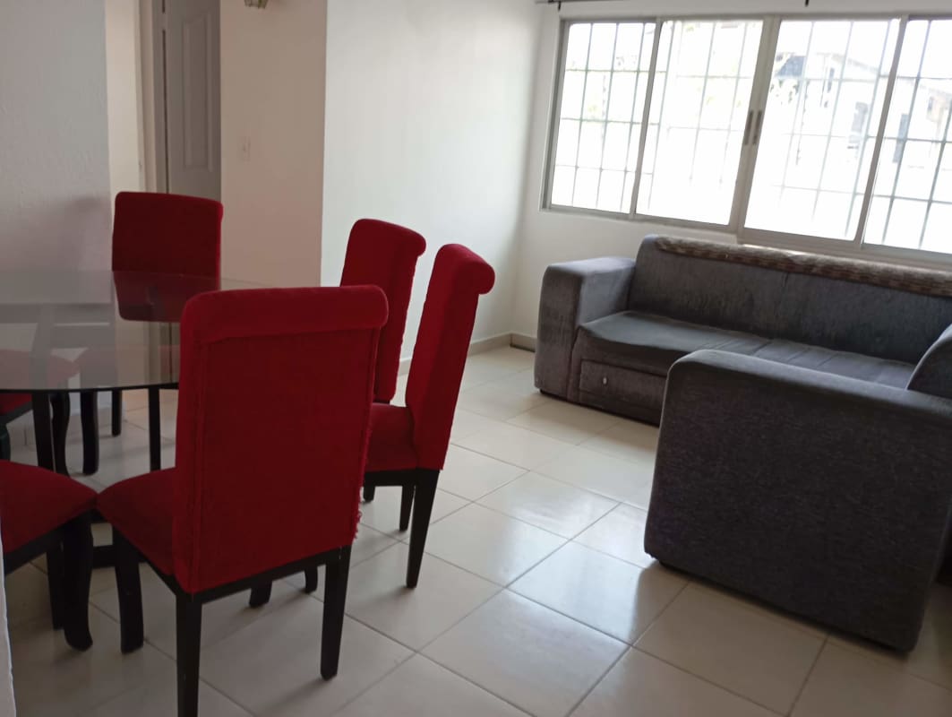 Bedroom with white walls, security bars on window ceramic tile floor PH Luna del Río Panama City