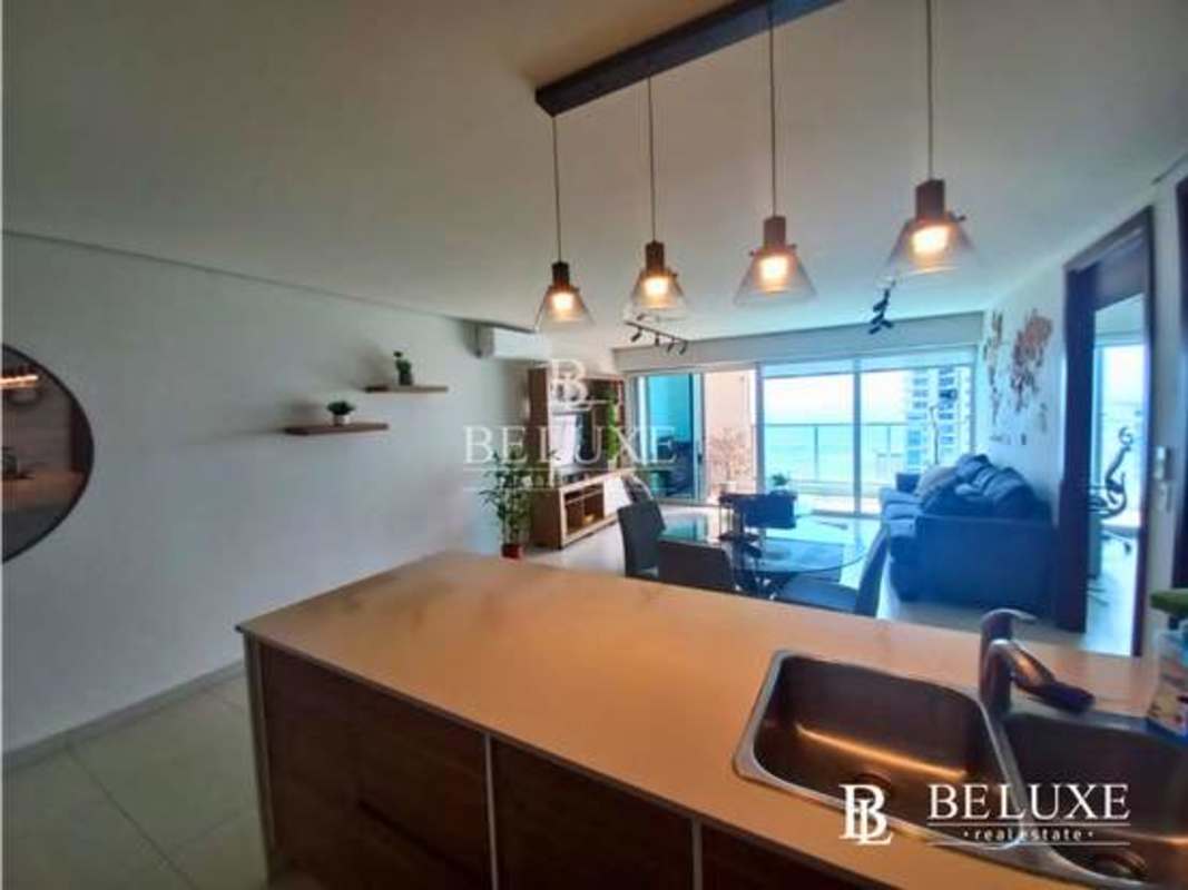 Spacious terrace with glass railing overlooking Pacific Ocean and Panama City skyline at PH Parkside Costa del Este