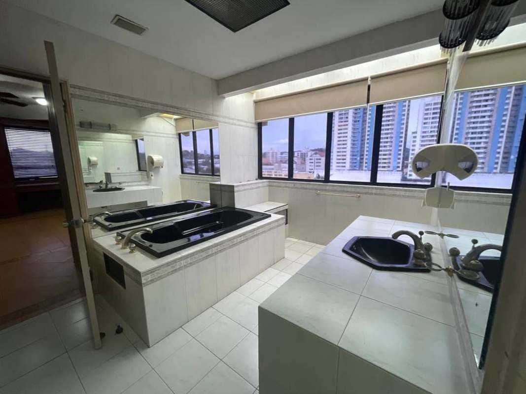 Contemporary bathroom with dual bathtubs, panoramic windows luxury home Dos Mares Panama City