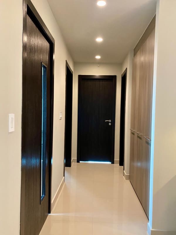 Master bedroom with large window panoramic Obarrio city skyline view at PH Lemon Tower Panama