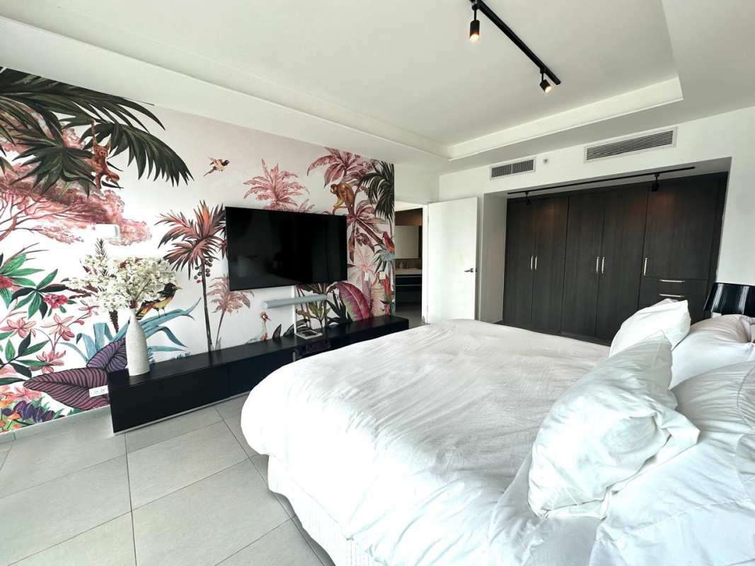 Modern bathroom with glass shower, bathtub, double vanity, window with city view at Yacht Club Tower Panama