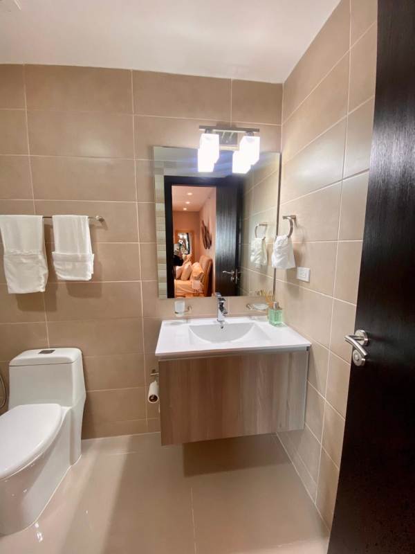 Contemporary bathroom with vanity sink mirror beige tiles PH Bellavista Urban Tower Panama