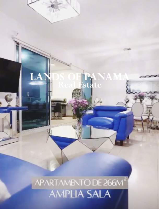 Master bedroom with tufted headboard, marble floor and large windows with ocean view in PH Pacific Village Punta Pacifica Panama