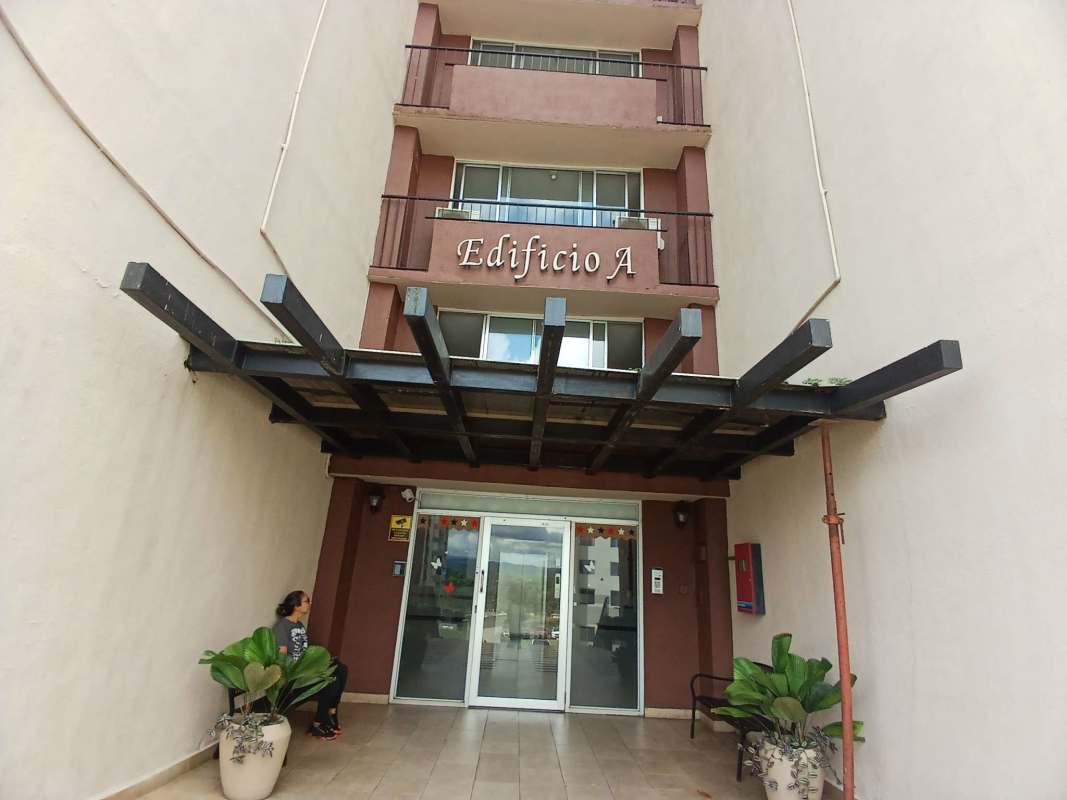 Modern kitchen with granite counters, gas stove and cabinets in Villa Zaita Panama apartment