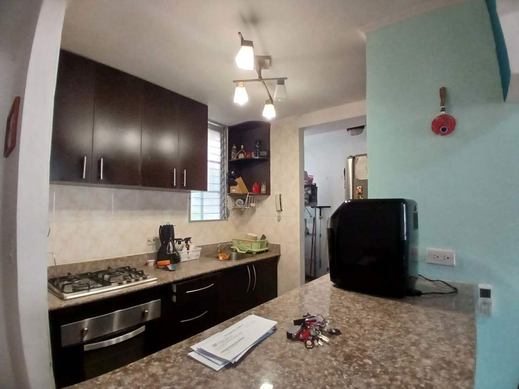 Bedroom with inverter AC, window blinds, and built-in closet in Villa Zaita apartment