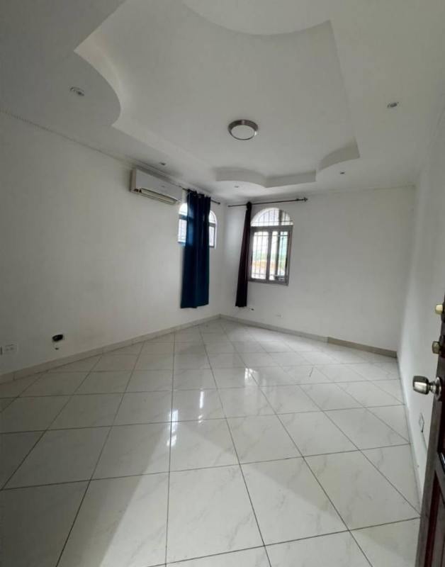 Bathroom with pedestal sink, shower enclosure, and tiled walls in Altos del Chase, Panama City