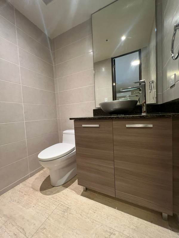 Spacious master bedroom with large windows, neutral tones, and walk-in closet PH The Regent Costa del Este Panama