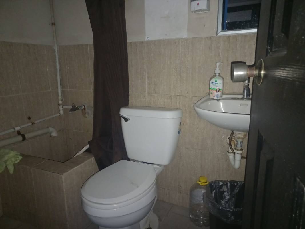 Private bathroom with basic fixtures inside retail commercial unit Plaza Business Gallery