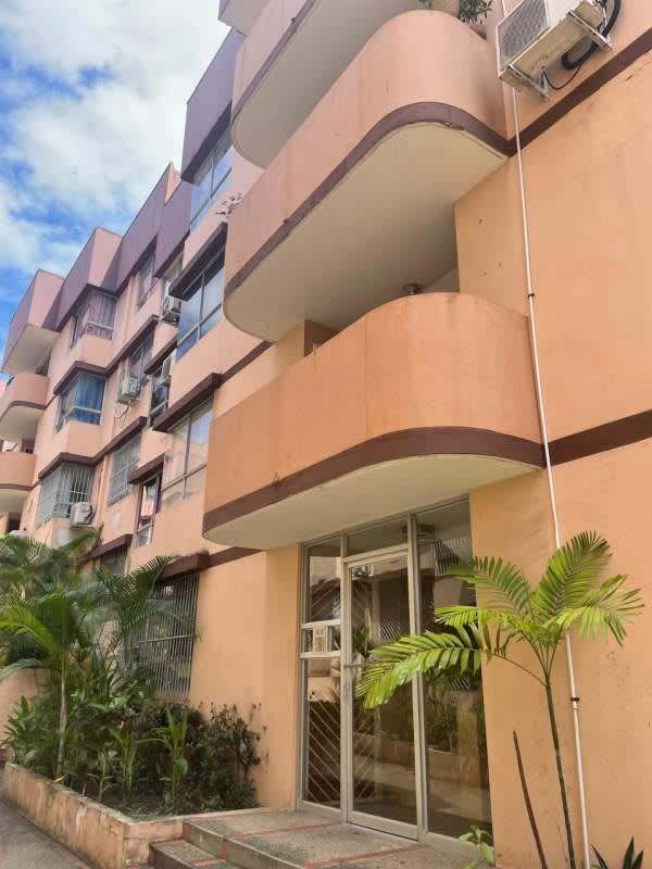 Simple open-plan living and dining with ceiling fan, tile floors, sofa, dining table in Villas El Carmen La Cresta