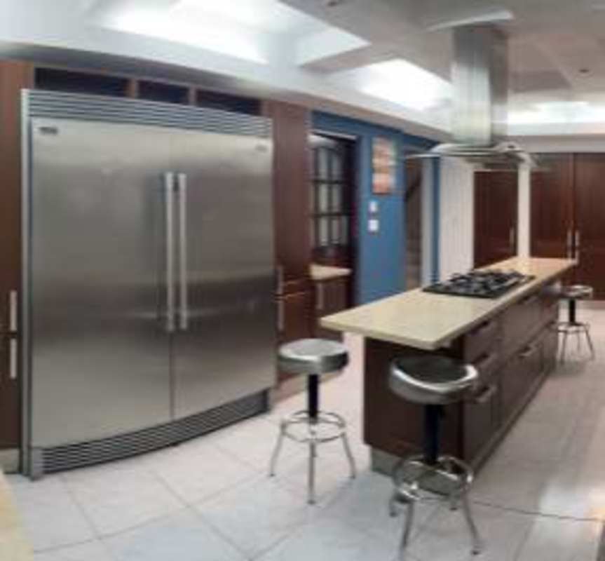 Modern luxury kitchen with granite island and stainless appliances in Altos de Betania Panama luxury home for sale