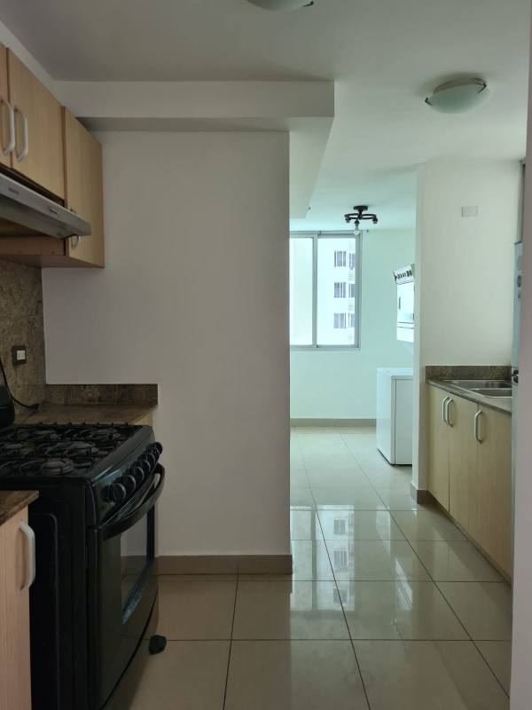 Kitchen with granite countertops stove and wood cabinets Condado del Rey Panama apartment
