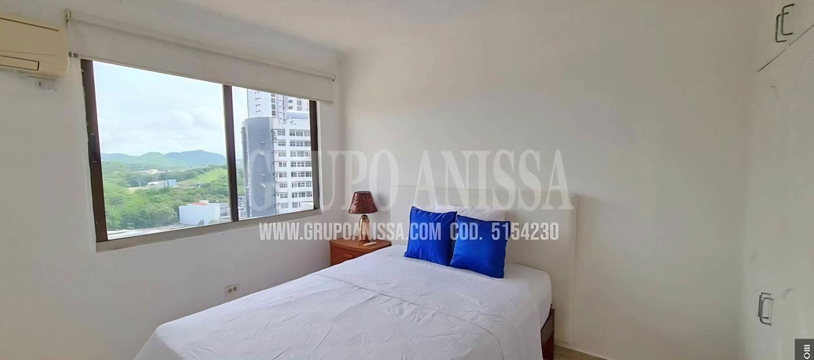 Bedroom with large window mountain city view AC closet PH Villa de las Fuentes Panama