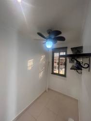 Living room with natural light tile floor window molding Montelimar Costa Verde Panama