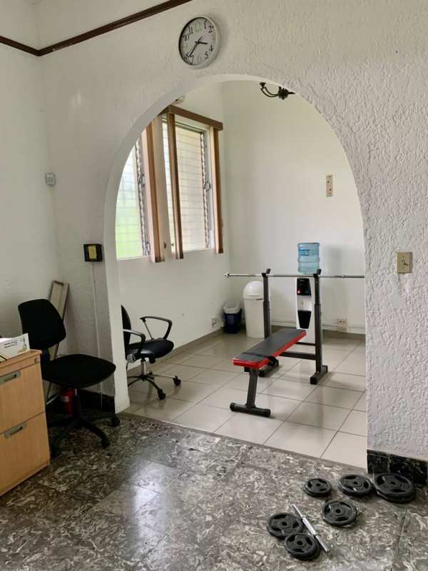 Bright office space with blinds and barred windows in Perejil mixed-use building Panama