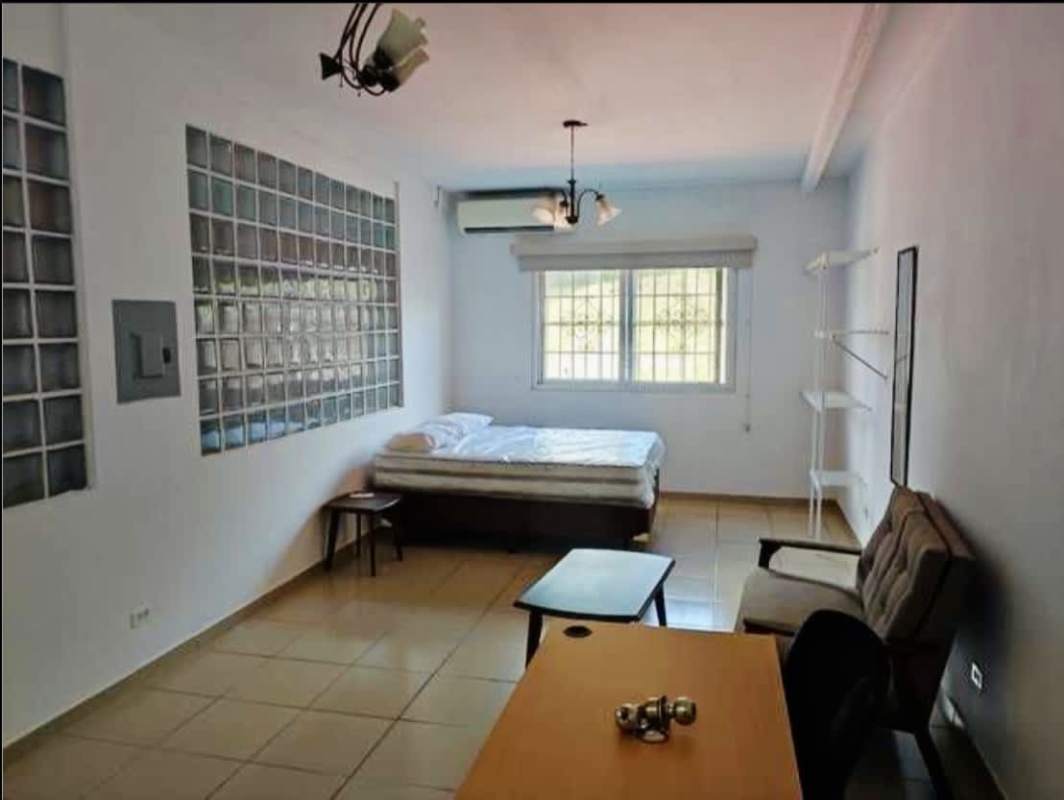 Spacious studio apartment with glass block wall and tile floors in Calidonia mixed-use building Panama City