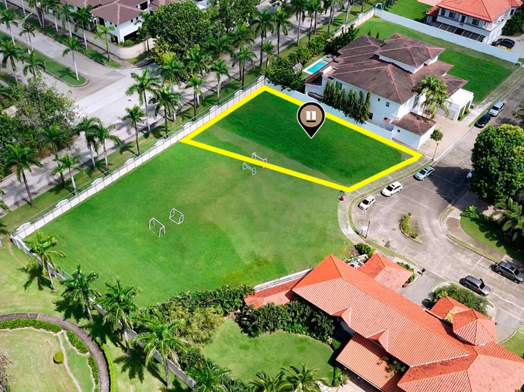 Aerial of grassy park and recreational field next to residential land PH Veranda Costa del Este Panama