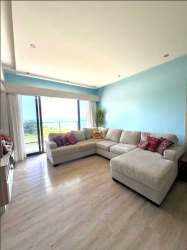 Bright living room with sliding doors to balcony oceanfront Royal Palm Panama Pacifico