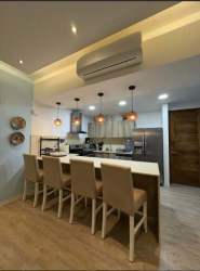 Ocean view master bedroom with king bed at Royal Palm Panama Pacifico