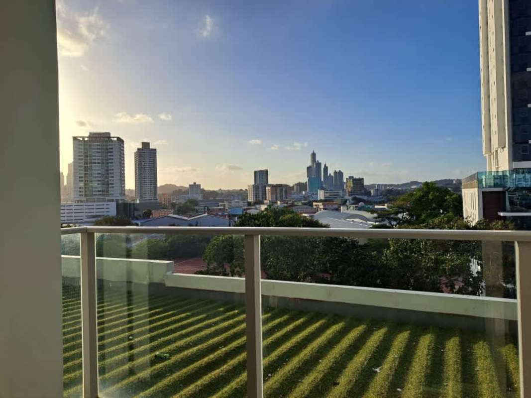 Spacious living room with large windows and balcony access in PH Torres de Castilla