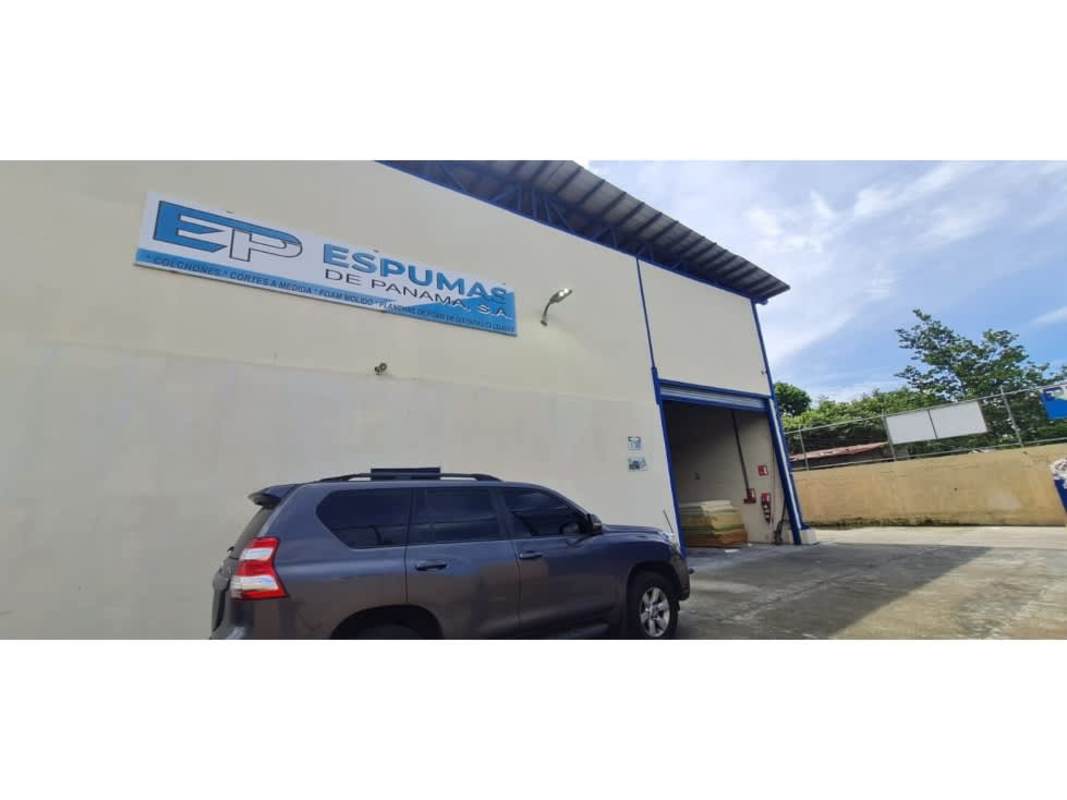 Business sign ESPUMAS DE PANAMA at industrial warehouse exterior Pueblo Nuevo Panama