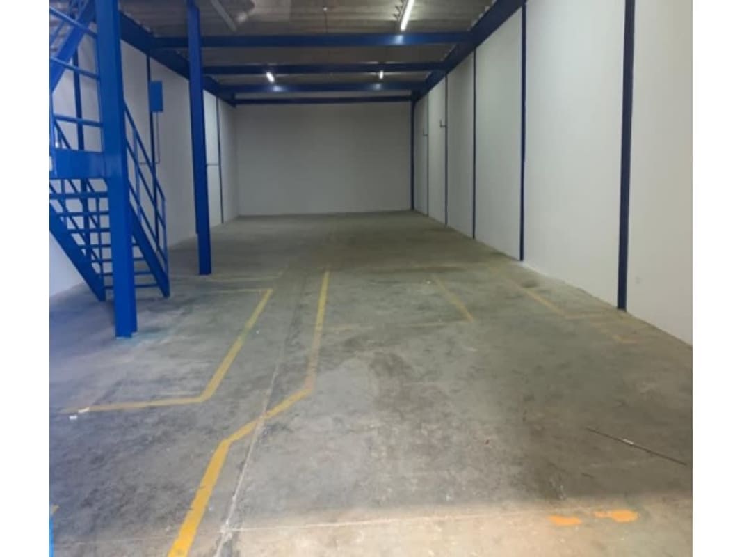 Interior of warehouse with mezzanine, metal stair and raw finish located in Juan Díaz industrial zone Panama