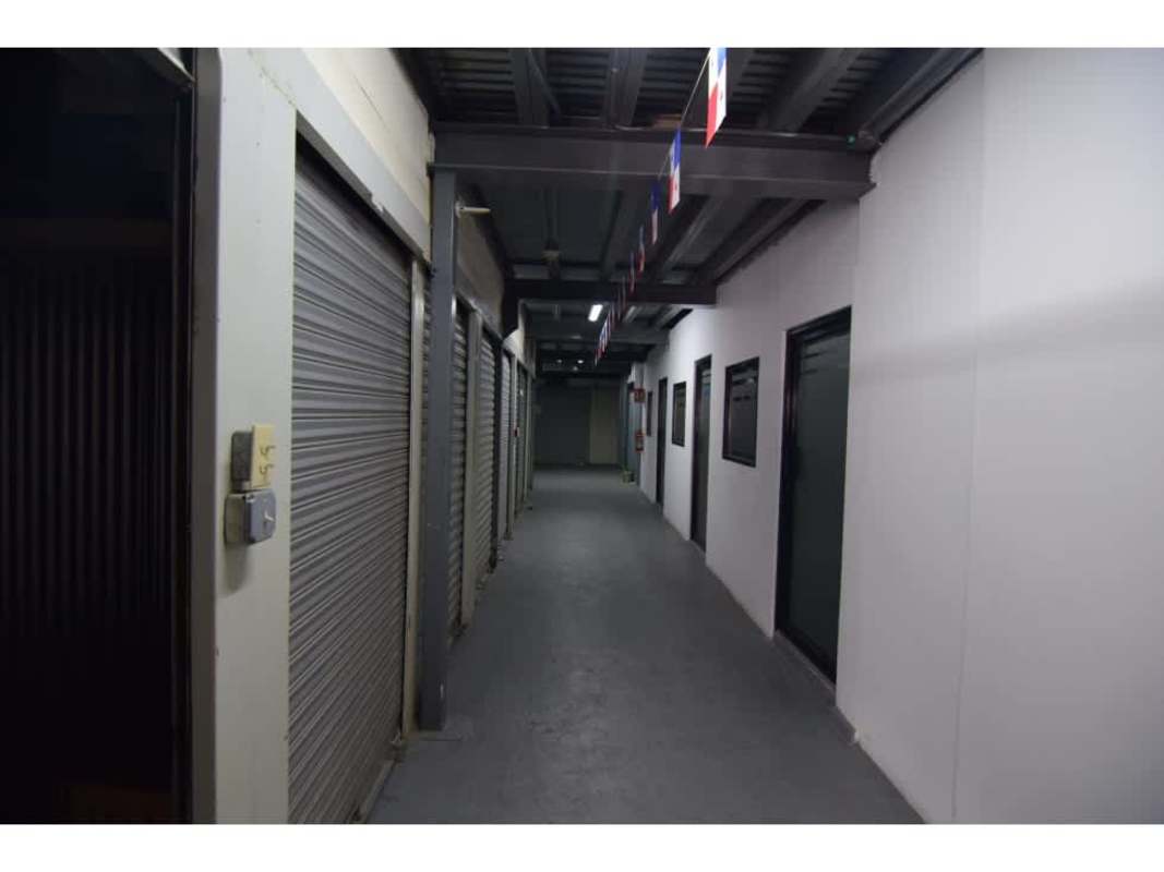 Industrial storage corridor with metal roll-up doors inside warehouse for sale in Panama