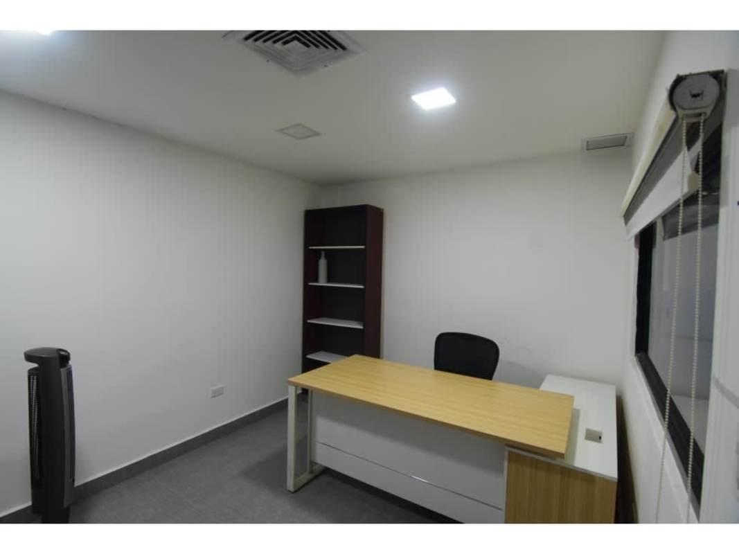 Newly finished commercial office inside warehouse in Rio Abajo with desk chairs and large window