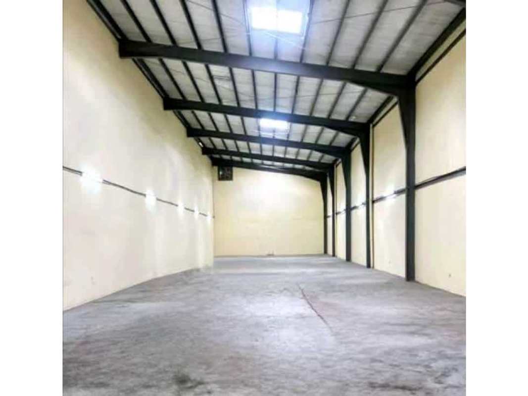 Spacious empty warehouse with high ceilings, skylight panels and concrete floor in Parque Lefevre Panama City