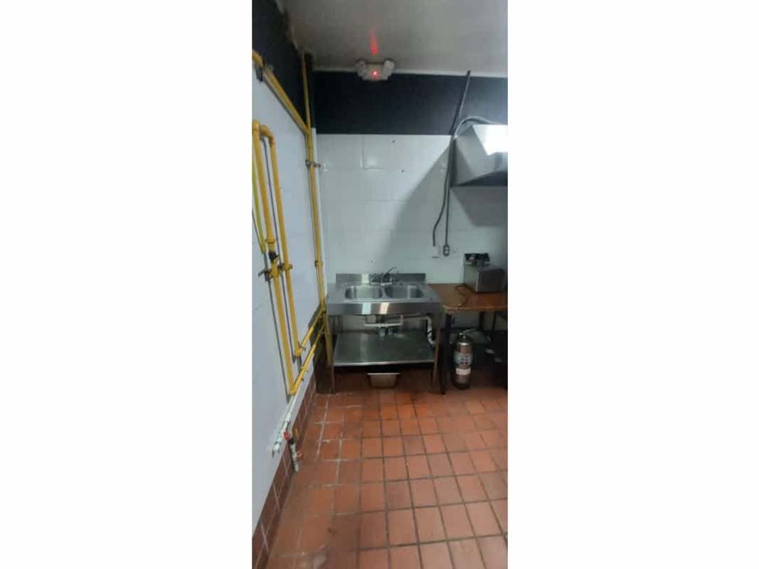 Modern commercial restroom with double sinks, toilets, and tiled flooring in Plaza Triumph Calle Uruguay Panama