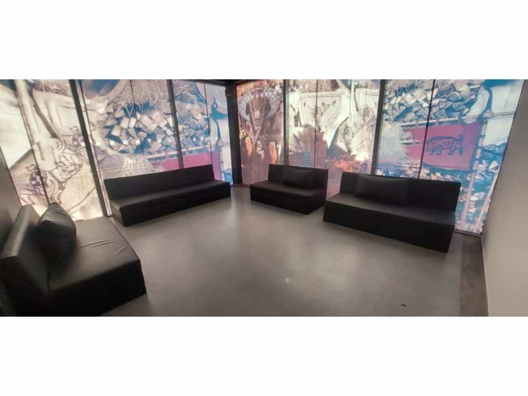 Modern commercial building with glass facade, signage, parking in Plaza Triumph Panama City