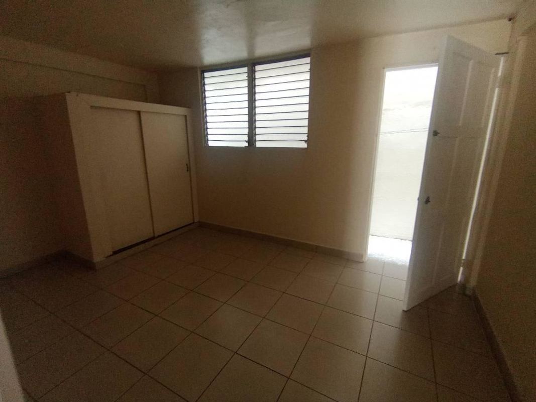 Outdoor enclosed utility courtyard with clotheslines, cement floor, privacy wall apartment for rent Rio Abajo Panama