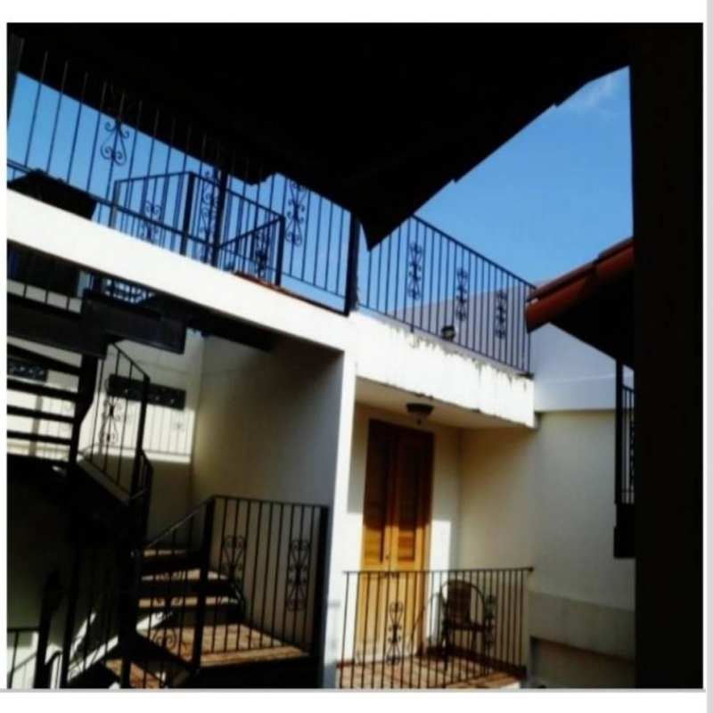 Mediterranean style spiral staircase and upper balcony courtyard in PH Casa Malecón Panama